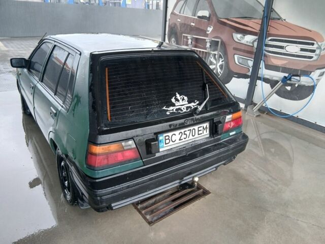 Зелений Ніссан 110, об'ємом двигуна 1.6 л та пробігом 400 тис. км за 600 $, фото 3 на Automoto.ua