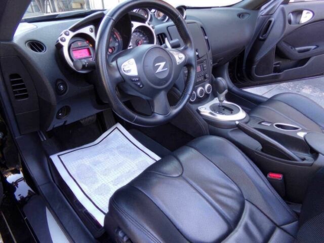 Черный Ниссан 370 З, объемом двигателя 3.7 л и пробегом 35 тыс. км за 12000 $, фото 6 на Automoto.ua