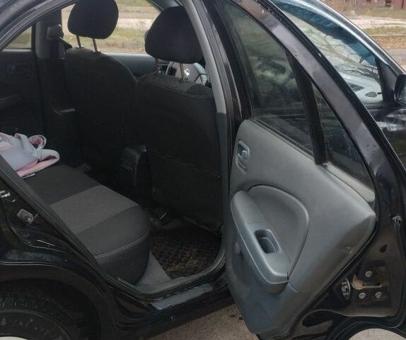 Черный Ниссан Альмера Классик, объемом двигателя 1.6 л и пробегом 262 тыс. км за 4500 $, фото 6 на Automoto.ua