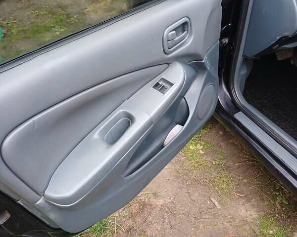 Черный Ниссан Альмера Классик, объемом двигателя 1.6 л и пробегом 182 тыс. км за 3600 $, фото 17 на Automoto.ua