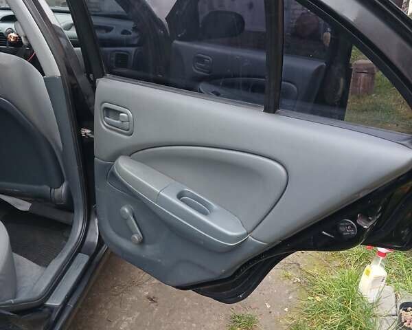 Черный Ниссан Альмера Классик, объемом двигателя 1.6 л и пробегом 182 тыс. км за 3600 $, фото 9 на Automoto.ua