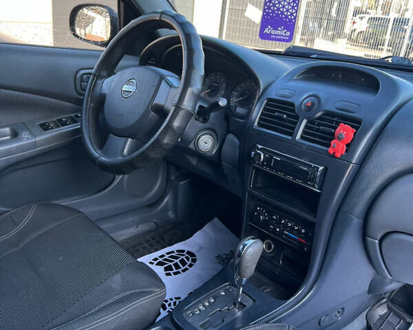 Черный Ниссан Альмера Классик, объемом двигателя 1.6 л и пробегом 250 тыс. км за 4800 $, фото 18 на Automoto.ua