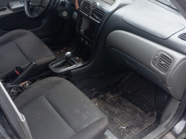 Черный Ниссан Альмера Классик, объемом двигателя 1.6 л и пробегом 300 тыс. км за 2000 $, фото 5 на Automoto.ua