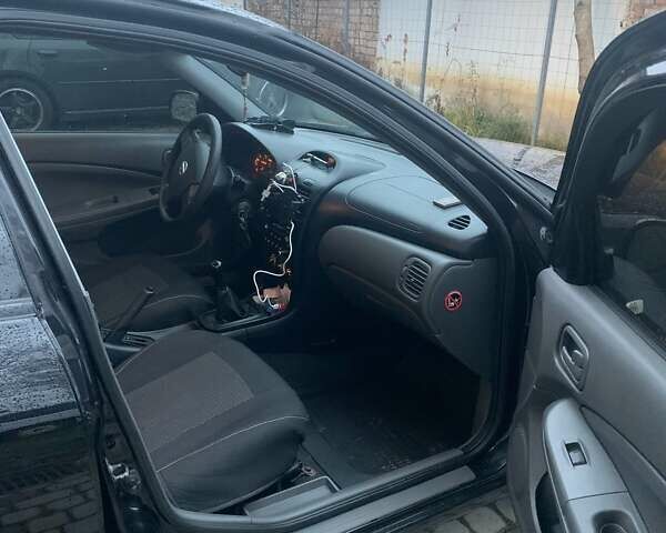 Черный Ниссан Альмера Классик, объемом двигателя 1.6 л и пробегом 167 тыс. км за 5999 $, фото 7 на Automoto.ua