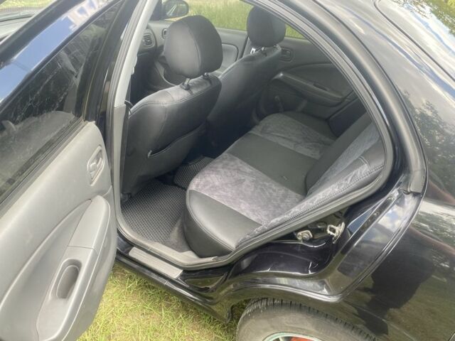 Черный Ниссан Альмера Классик, объемом двигателя 1.6 л и пробегом 157 тыс. км за 5000 $, фото 7 на Automoto.ua