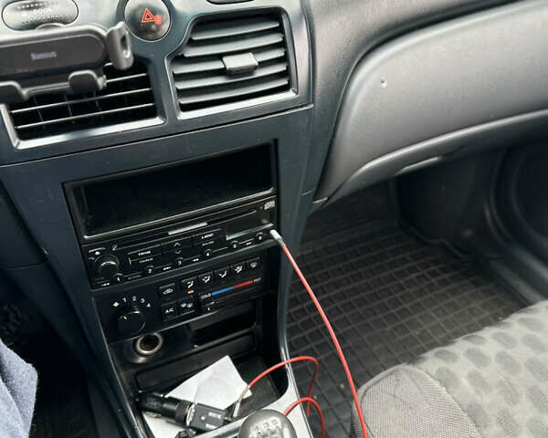 Сірий Ніссан Альмера Класік, об'ємом двигуна 1.6 л та пробігом 261 тис. км за 2700 $, фото 17 на Automoto.ua