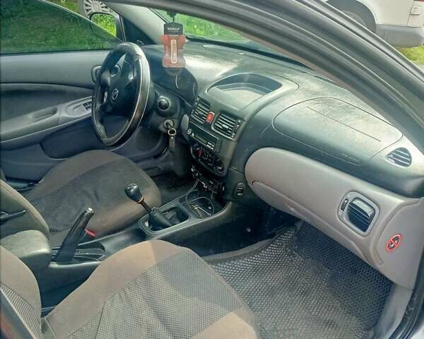 Белый Ниссан Альмера, объемом двигателя 1.5 л и пробегом 180 тыс. км за 2500 $, фото 7 на Automoto.ua