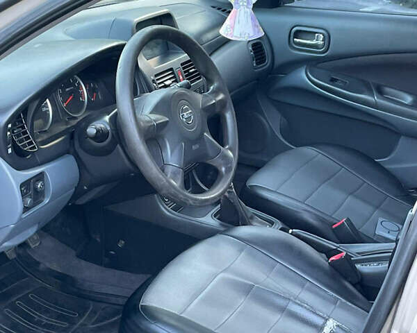 Бежевый Ниссан Альмера, объемом двигателя 1.5 л и пробегом 250 тыс. км за 4300 $, фото 9 на Automoto.ua