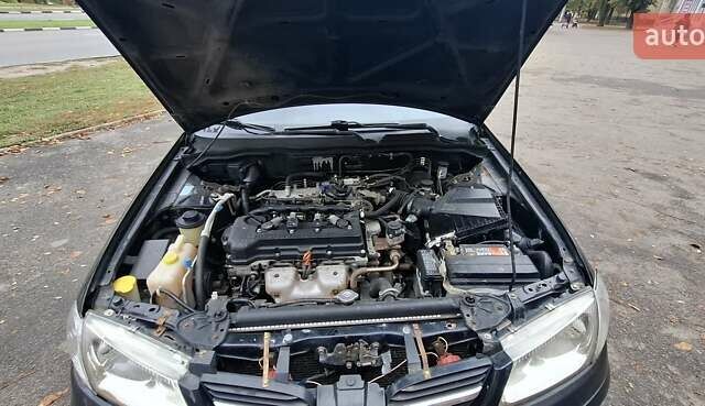 Черный Ниссан Альмера, объемом двигателя 1.5 л и пробегом 243 тыс. км за 2700 $, фото 7 на Automoto.ua