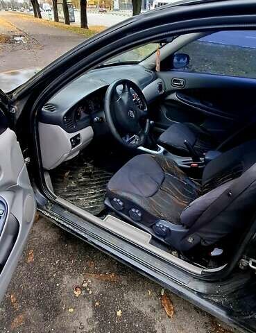 Черный Ниссан Альмера, объемом двигателя 1.5 л и пробегом 243 тыс. км за 2700 $, фото 5 на Automoto.ua