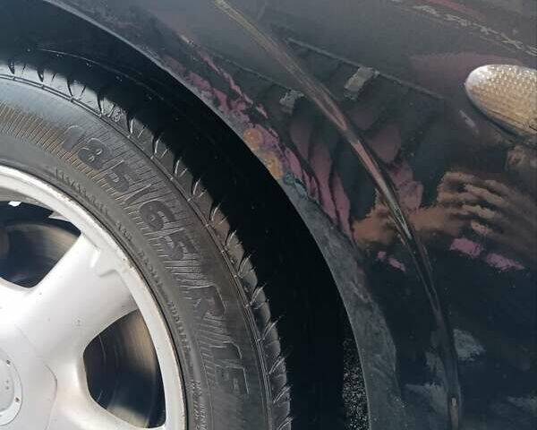 Черный Ниссан Альмера, объемом двигателя 1.5 л и пробегом 435 тыс. км за 2800 $, фото 3 на Automoto.ua