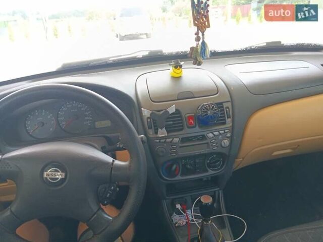 Черный Ниссан Альмера, объемом двигателя 1.5 л и пробегом 435 тыс. км за 2800 $, фото 20 на Automoto.ua