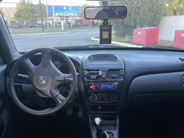 Черный Ниссан Альмера, объемом двигателя 1.5 л и пробегом 322 тыс. км за 3050 $, фото 4 на Automoto.ua