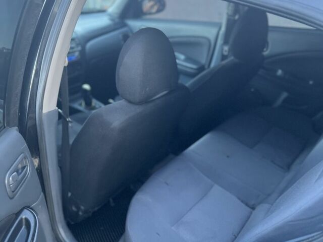 Черный Ниссан Альмера, объемом двигателя 1.5 л и пробегом 322 тыс. км за 3050 $, фото 5 на Automoto.ua