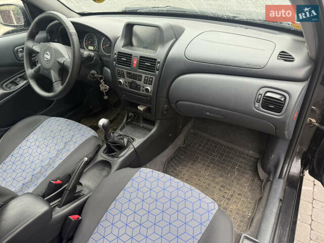 Чорний Ніссан Альмера, об'ємом двигуна 1.5 л та пробігом 183 тис. км за 3950 $, фото 7 на Automoto.ua