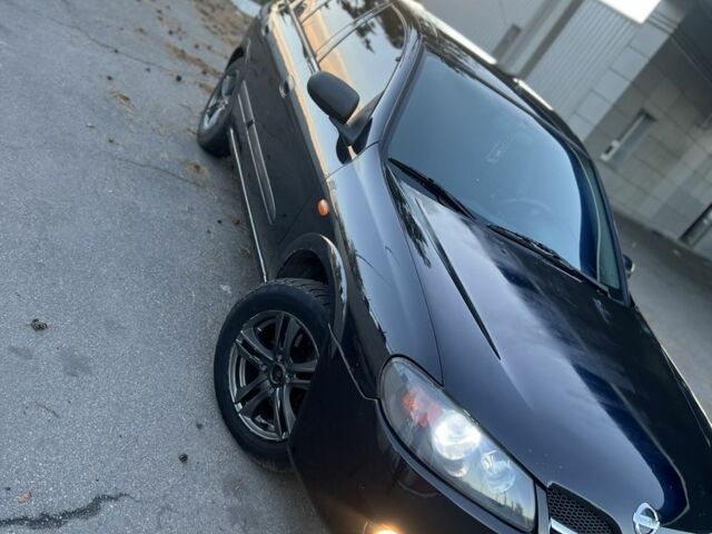 Черный Ниссан Альмера, объемом двигателя 1.5 л и пробегом 322 тыс. км за 3050 $, фото 2 на Automoto.ua