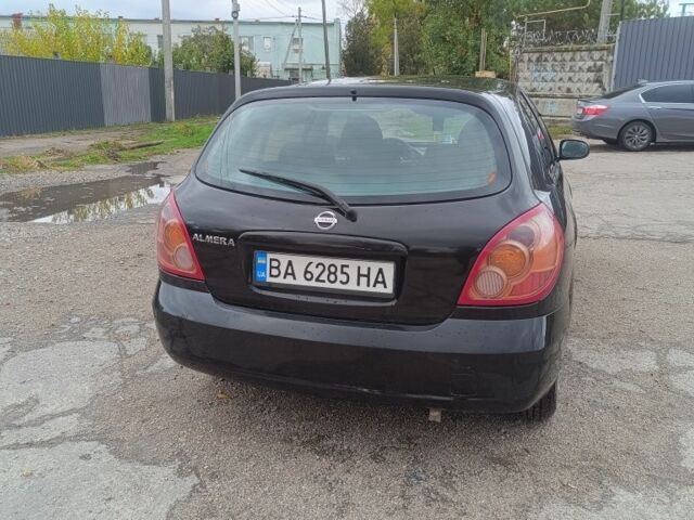 Черный Ниссан Альмера, объемом двигателя 1.5 л и пробегом 205 тыс. км за 3700 $, фото 2 на Automoto.ua