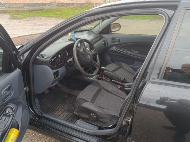 Черный Ниссан Альмера, объемом двигателя 1.5 л и пробегом 205 тыс. км за 3700 $, фото 3 на Automoto.ua