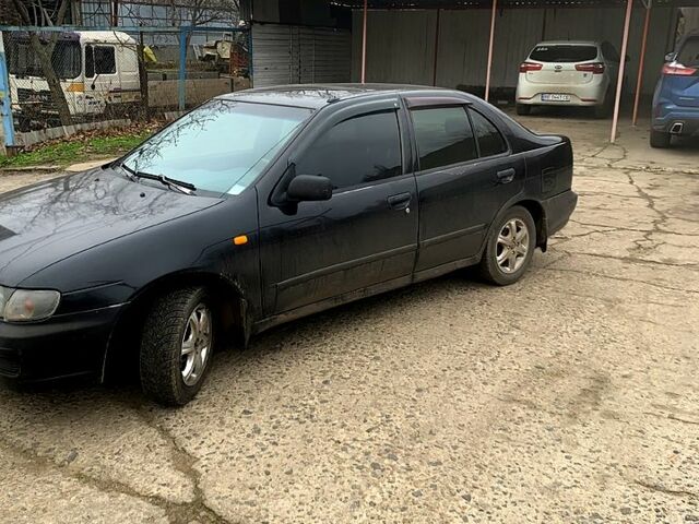Черный Ниссан Альмера, объемом двигателя 1.4 л и пробегом 0 тыс. км за 1700 $, фото 1 на Automoto.ua