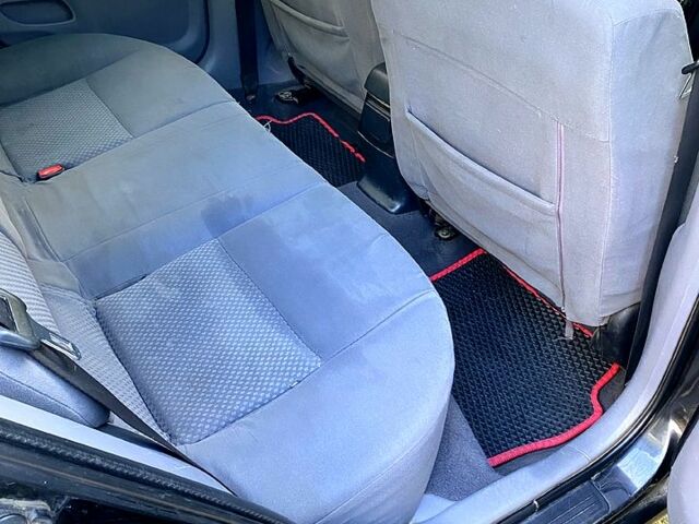 Черный Ниссан Альмера, объемом двигателя 1.5 л и пробегом 221 тыс. км за 3500 $, фото 9 на Automoto.ua