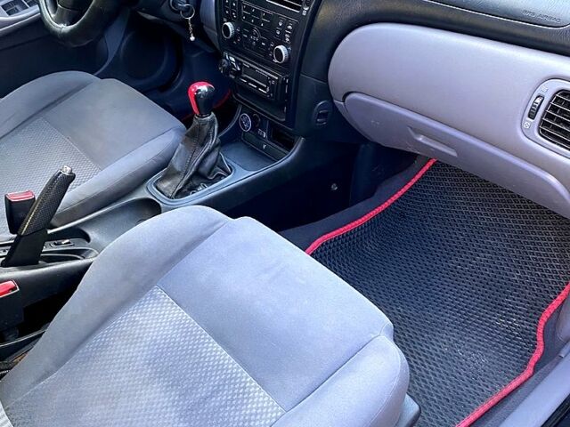 Черный Ниссан Альмера, объемом двигателя 1.5 л и пробегом 221 тыс. км за 3500 $, фото 7 на Automoto.ua