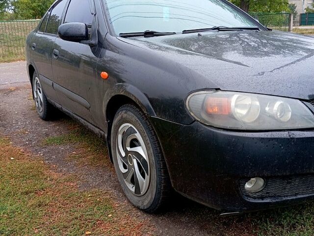 Черный Ниссан Альмера, объемом двигателя 1.5 л и пробегом 315 тыс. км за 2650 $, фото 2 на Automoto.ua