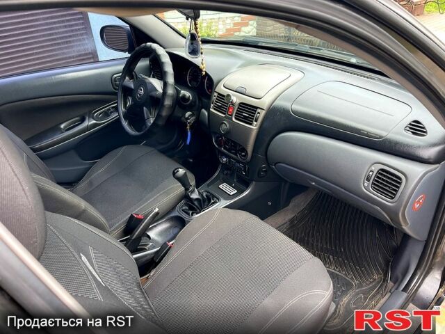 Черный Ниссан Альмера, объемом двигателя 1.5 л и пробегом 220 тыс. км за 2700 $, фото 9 на Automoto.ua