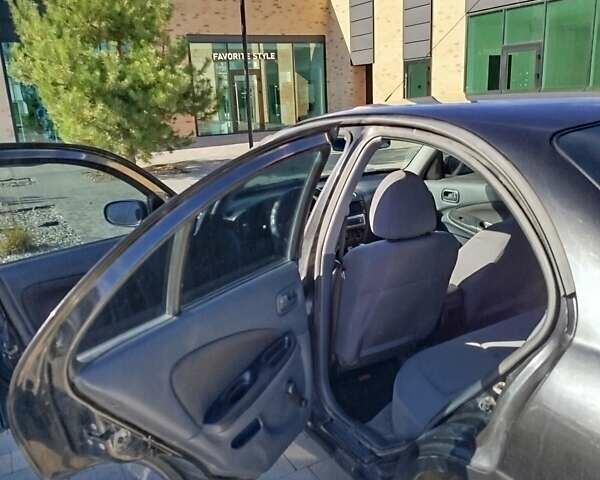 Черный Ниссан Альмера, объемом двигателя 1.5 л и пробегом 269 тыс. км за 2550 $, фото 8 на Automoto.ua