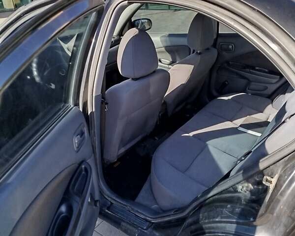 Черный Ниссан Альмера, объемом двигателя 1.5 л и пробегом 269 тыс. км за 2550 $, фото 13 на Automoto.ua