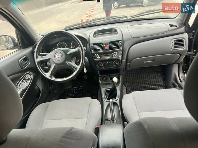 Черный Ниссан Альмера, объемом двигателя 1.77 л и пробегом 203 тыс. км за 3200 $, фото 24 на Automoto.ua