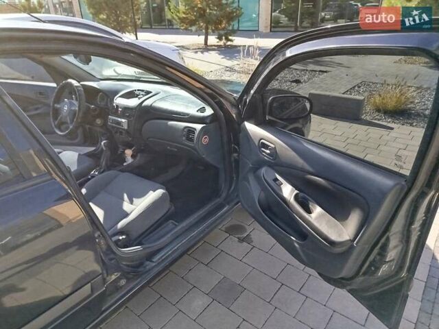 Черный Ниссан Альмера, объемом двигателя 1.5 л и пробегом 269 тыс. км за 2550 $, фото 22 на Automoto.ua