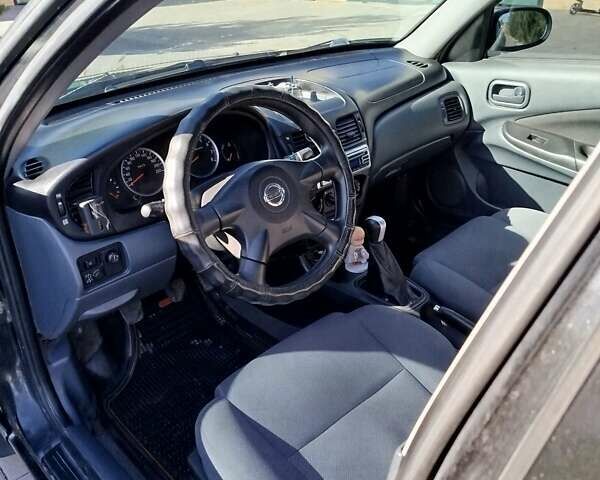 Черный Ниссан Альмера, объемом двигателя 1.5 л и пробегом 269 тыс. км за 2550 $, фото 3 на Automoto.ua