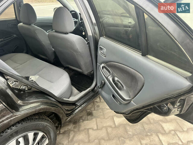 Черный Ниссан Альмера, объемом двигателя 1.77 л и пробегом 203 тыс. км за 3200 $, фото 21 на Automoto.ua