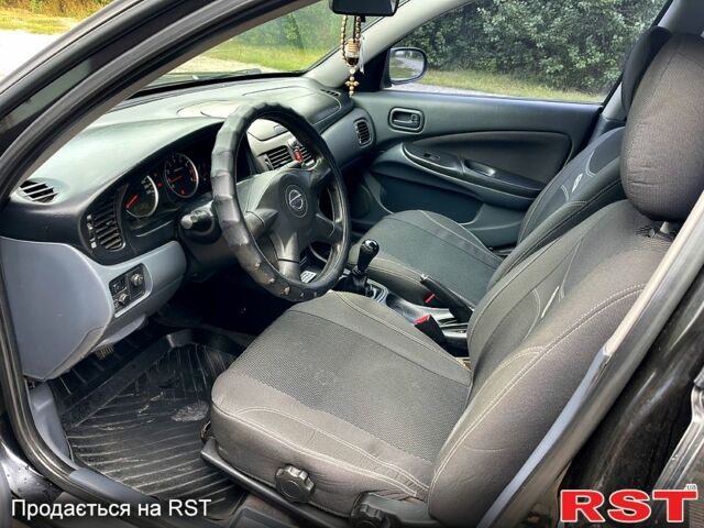 Черный Ниссан Альмера, объемом двигателя 1.5 л и пробегом 220 тыс. км за 2700 $, фото 6 на Automoto.ua