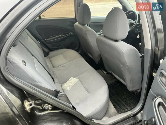 Черный Ниссан Альмера, объемом двигателя 1.77 л и пробегом 203 тыс. км за 3200 $, фото 23 на Automoto.ua