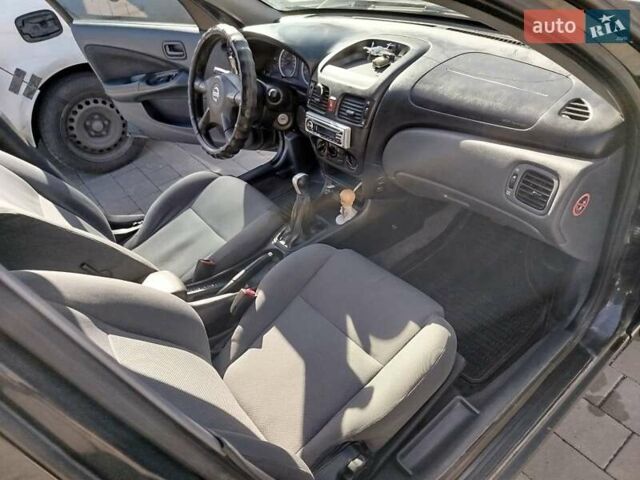Черный Ниссан Альмера, объемом двигателя 1.5 л и пробегом 269 тыс. км за 2550 $, фото 14 на Automoto.ua
