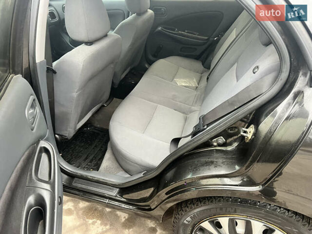 Черный Ниссан Альмера, объемом двигателя 1.77 л и пробегом 203 тыс. км за 3200 $, фото 17 на Automoto.ua