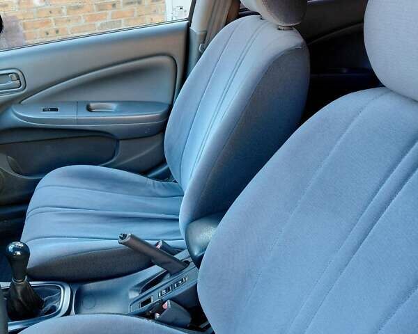 Чорний Ніссан Альмера, об'ємом двигуна 1.6 л та пробігом 210 тис. км за 4600 $, фото 9 на Automoto.ua