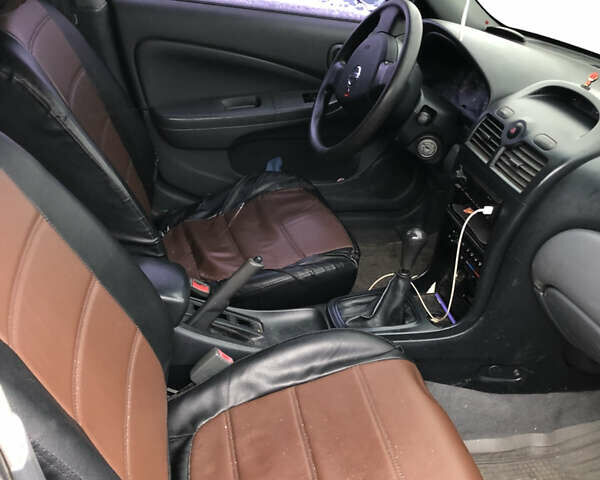 Чорний Ніссан Альмера, об'ємом двигуна 1.6 л та пробігом 232 тис. км за 5000 $, фото 5 на Automoto.ua