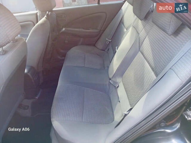 Чорний Ніссан Альмера, об'ємом двигуна 1.6 л та пробігом 185 тис. км за 4500 $, фото 64 на Automoto.ua