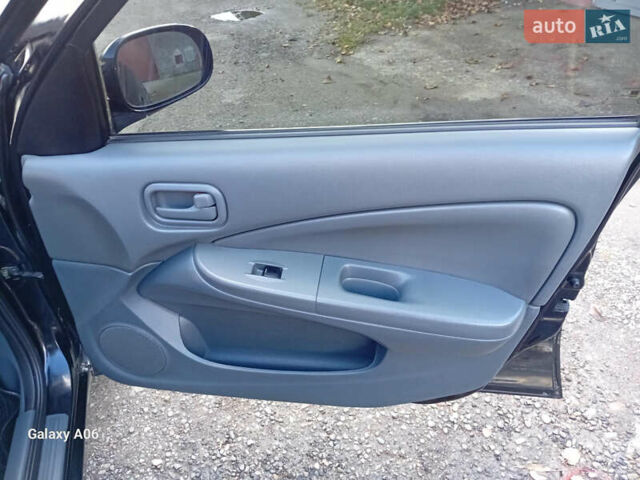 Черный Ниссан Альмера, объемом двигателя 1.6 л и пробегом 185 тыс. км за 4500 $, фото 52 на Automoto.ua