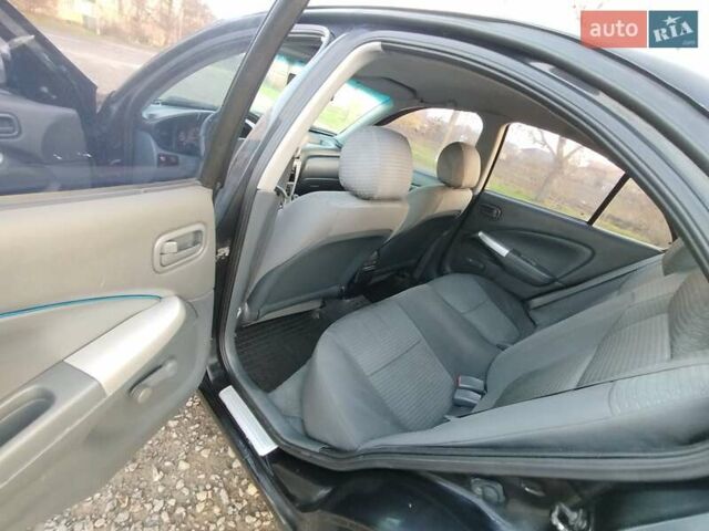 Черный Ниссан Альмера, объемом двигателя 1.6 л и пробегом 244 тыс. км за 4500 $, фото 47 на Automoto.ua