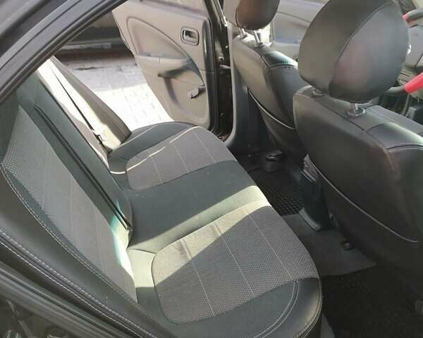 Черный Ниссан Альмера, объемом двигателя 1.6 л и пробегом 230 тыс. км за 5000 $, фото 3 на Automoto.ua