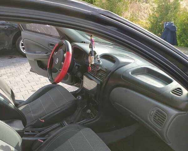 Черный Ниссан Альмера, объемом двигателя 1.6 л и пробегом 230 тыс. км за 5000 $, фото 4 на Automoto.ua