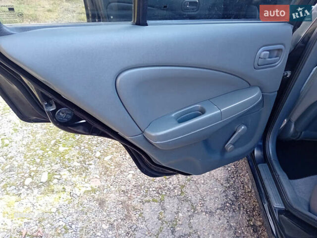 Черный Ниссан Альмера, объемом двигателя 1.6 л и пробегом 185 тыс. км за 4500 $, фото 51 на Automoto.ua