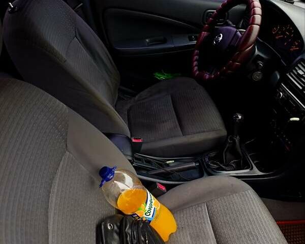 Черный Ниссан Альмера, объемом двигателя 1.6 л и пробегом 224 тыс. км за 3300 $, фото 3 на Automoto.ua