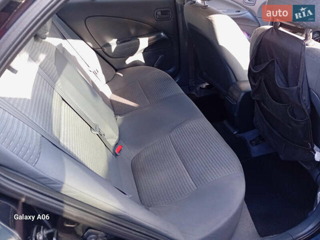 Черный Ниссан Альмера, объемом двигателя 1.6 л и пробегом 185 тыс. км за 4500 $, фото 60 на Automoto.ua