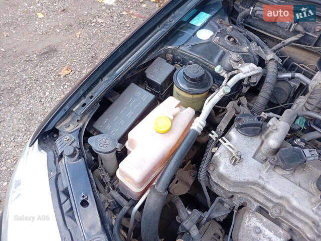 Черный Ниссан Альмера, объемом двигателя 1.6 л и пробегом 185 тыс. км за 4500 $, фото 91 на Automoto.ua