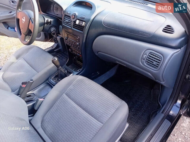 Черный Ниссан Альмера, объемом двигателя 1.6 л и пробегом 185 тыс. км за 4500 $, фото 59 на Automoto.ua