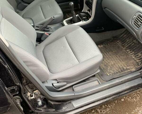 Чорний Ніссан Альмера, об'ємом двигуна 1.6 л та пробігом 300 тис. км за 2999 $, фото 7 на Automoto.ua